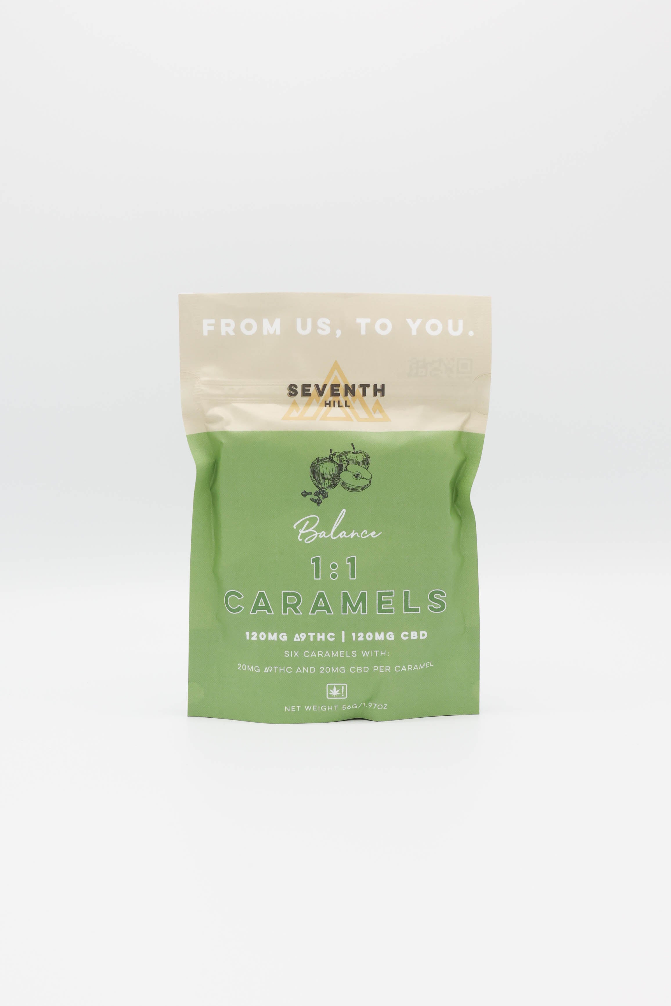 A stand-up pouch of Seventh Hill's 1:1 Balance Caramels on a clean white background. The packaging features a dark green lower half with white text and a beige top flap with the text 'FROM US, TO YOU.