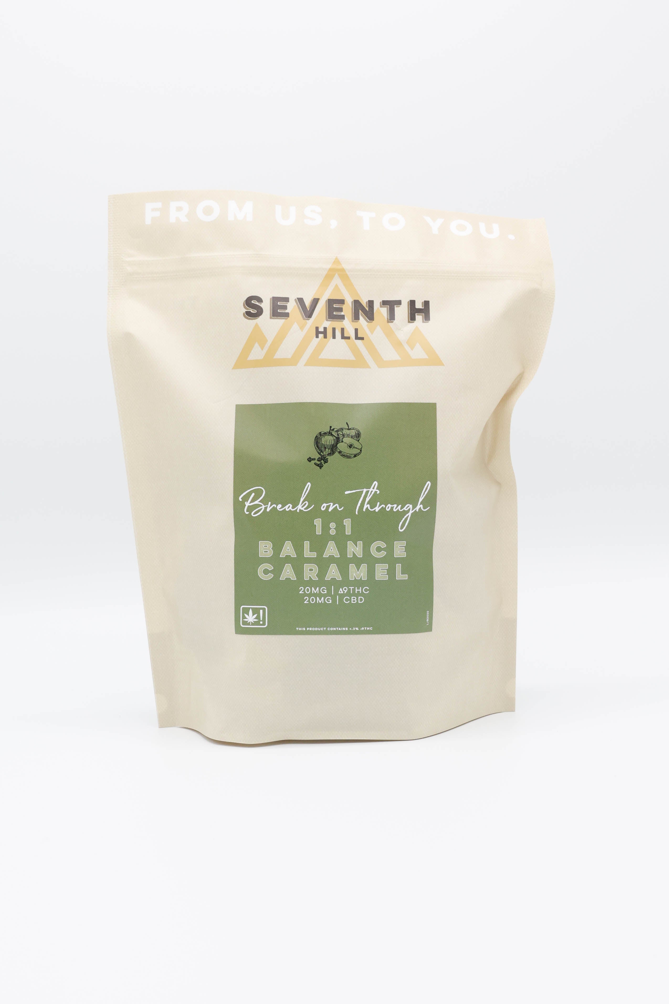 A stand-up pouch of Seventh Hill 1:1 Balance Caramels on a clean white background. The pouch is a warm cream color with a dark green label and gold logo.