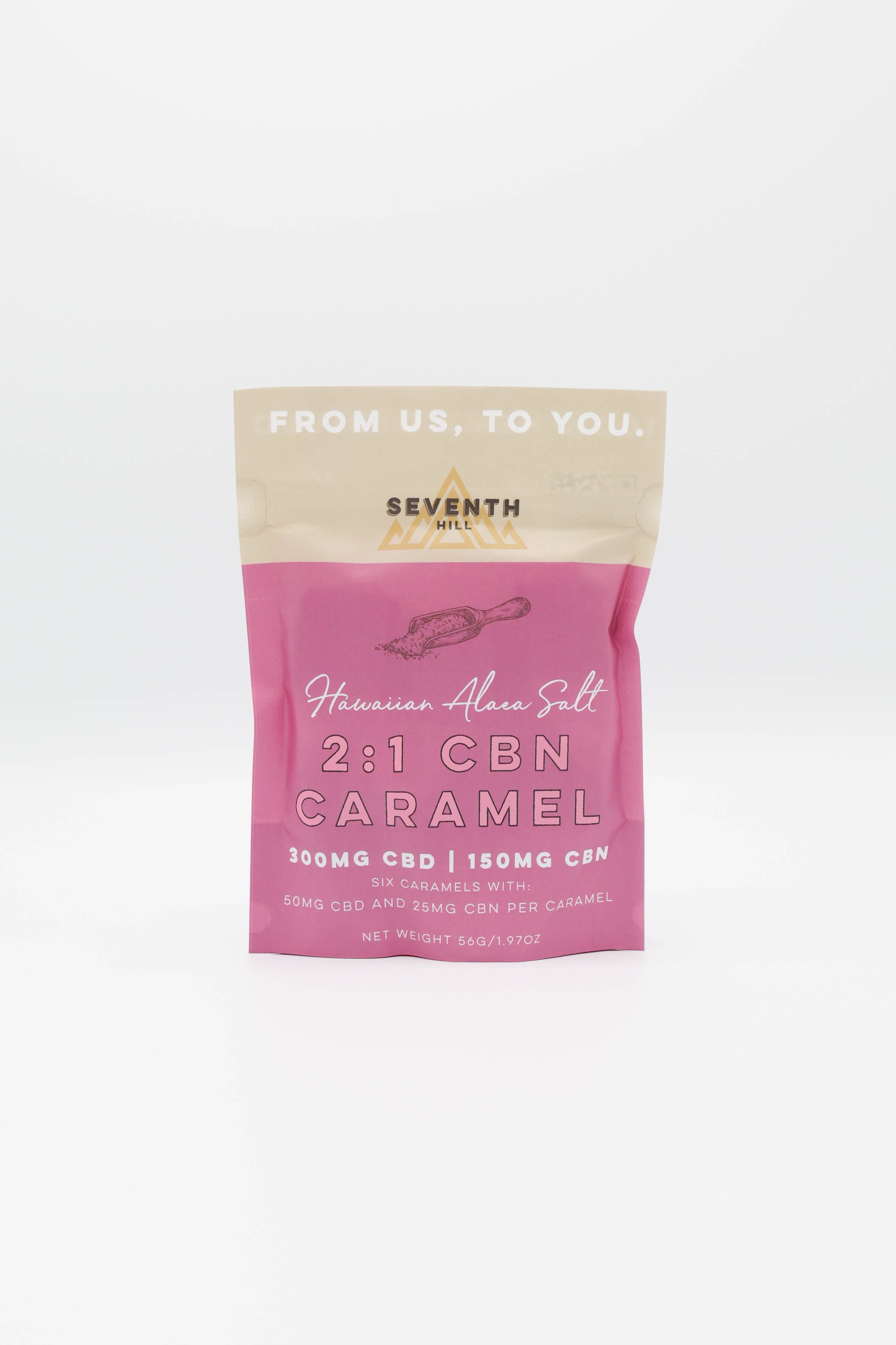 A pink and beige pouch of Seventh Hill Hawaiian Alaea Salt 2:1 CBN caramel, displayed on a clean white background.