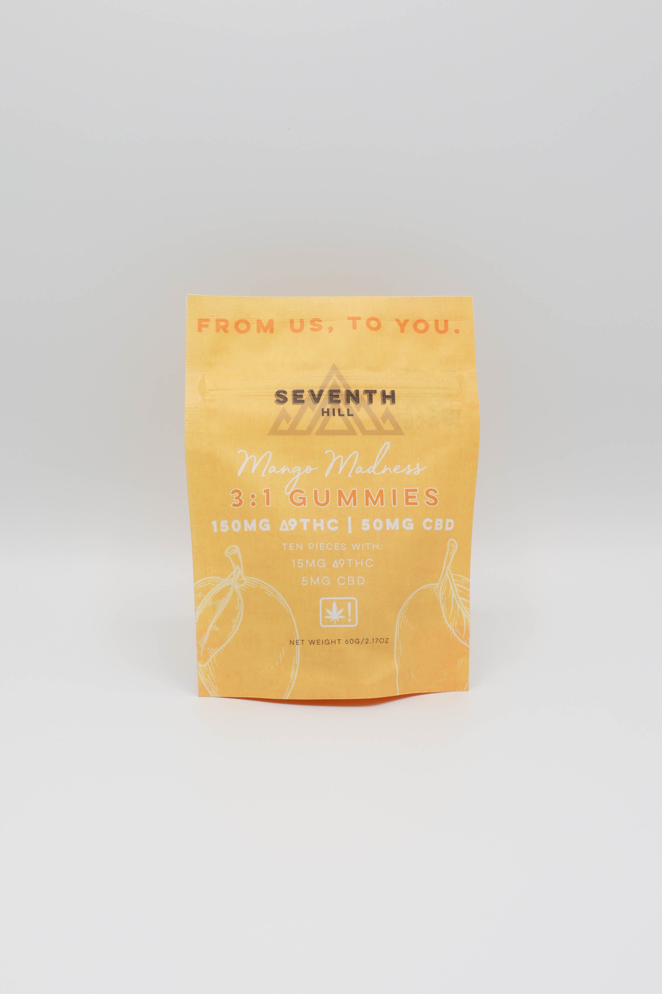A stand-up pouch of Seventh Hill Mango Madness 3:1 Gummies, featuring a warm yellow-orange design with white and dark text, photographed on a white background.