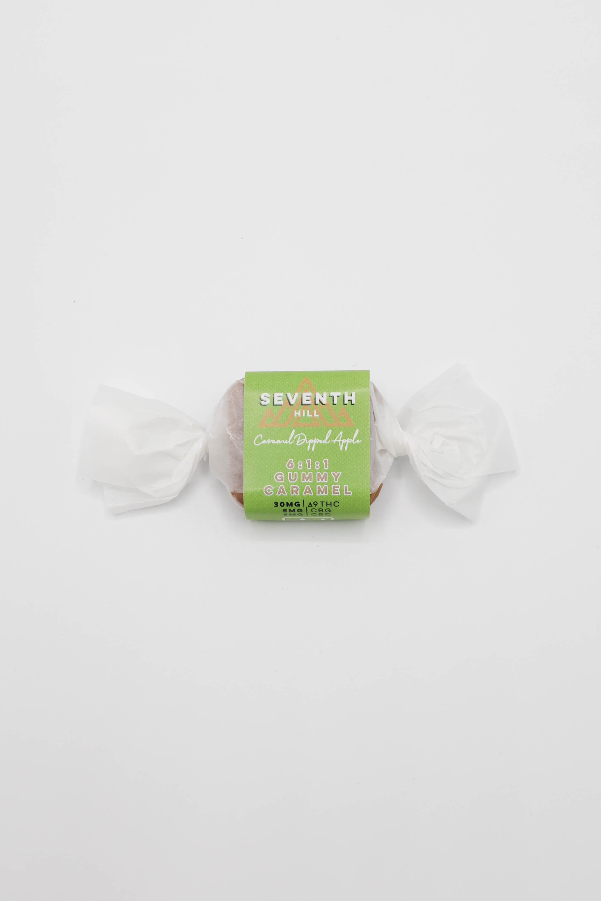 A single wrapped piece of Seventh Hill 6:1:1 Caramel Dipped Apple Gummy on a clean white background.