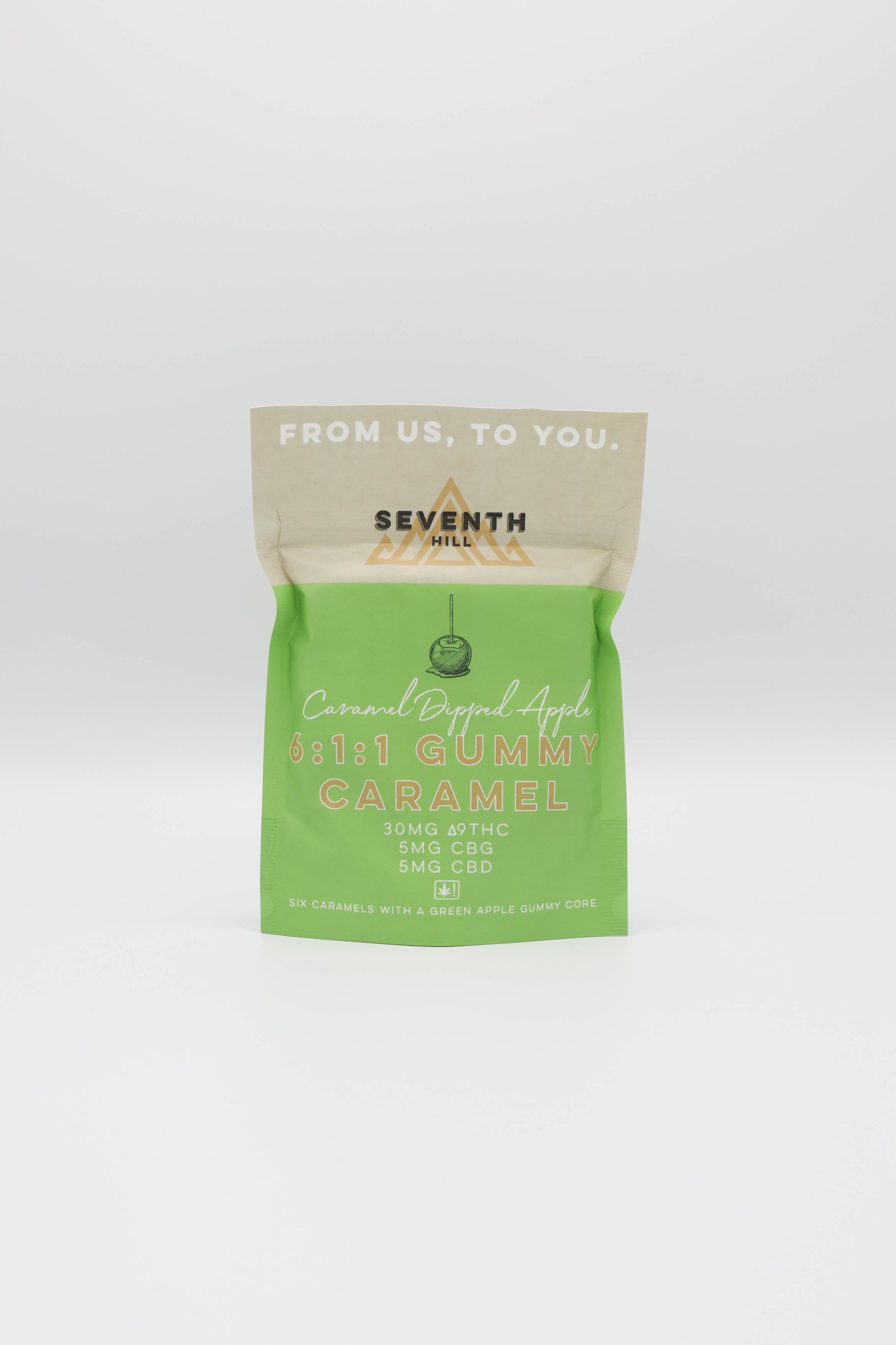 A sealed pouch of Seventh Hills 6:1:1 Caramel Dipped Apple Gummy, featuring a light green lower half and a beige top flap with white text, on a white background.