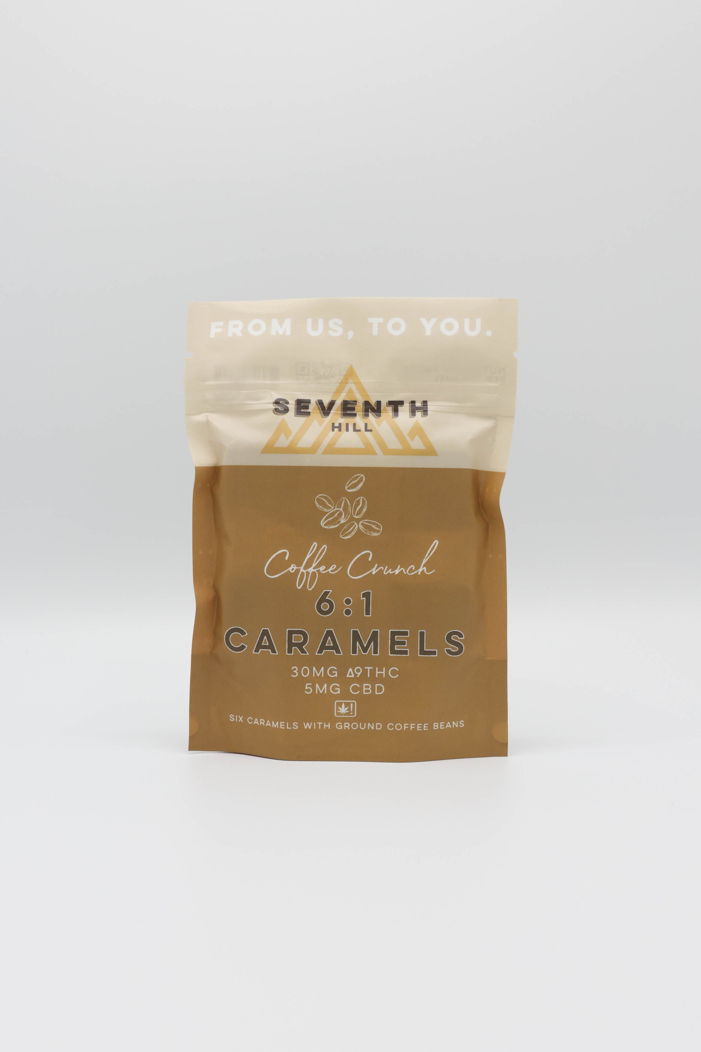 A stand-up pouch of Seventh Hill Coffee Crunch 6:1 Caramels, featuring a two-tone design with cream on the top half and a warm brown lower half, set against a plain white background.