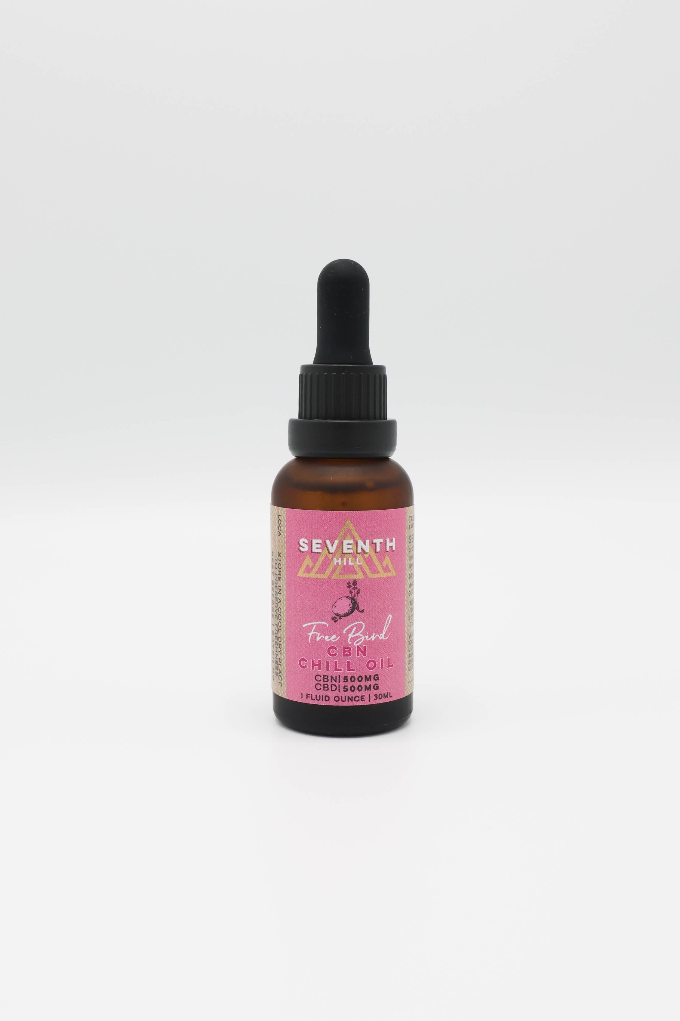 A small amber glass dropper bottle with a black rubber pipette top and a pink label reading 'SEVENTH HILL' and 'Free Bird CBN Oil', centered on a white background.