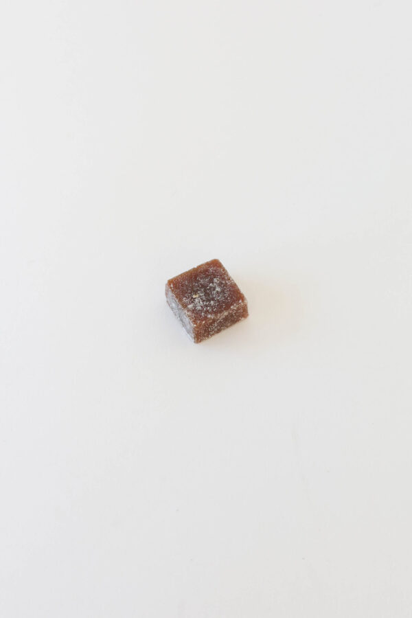 A hard candy caramel infused with hemp derived extract and coated with a light corn starch dust to prevent sticking.