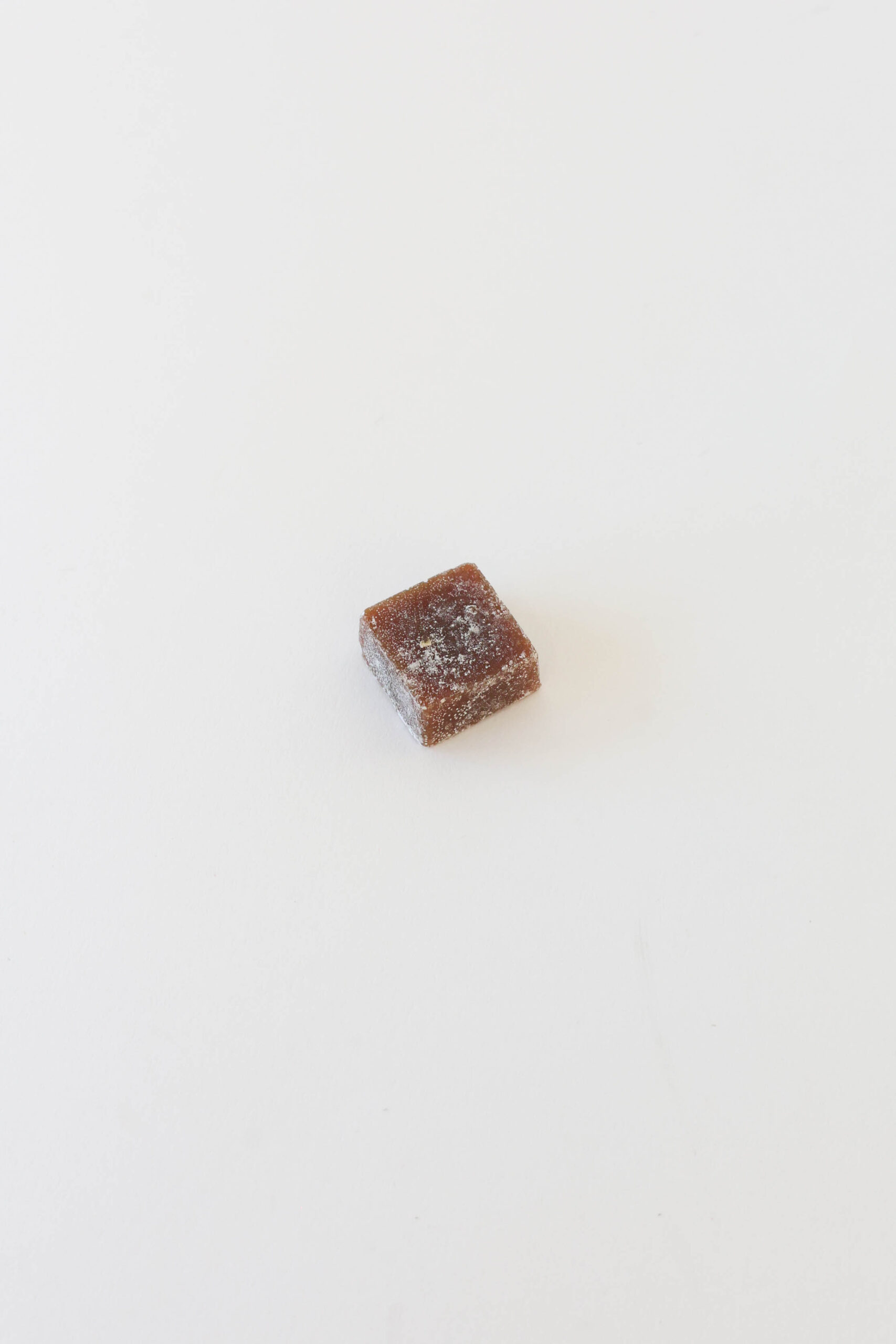 A hard candy caramel infused with hemp derived extract and coated with a light corn starch dust to prevent sticking.